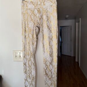 Fabletics Stylish Gold and White Snake Print Leggings and sports bra set